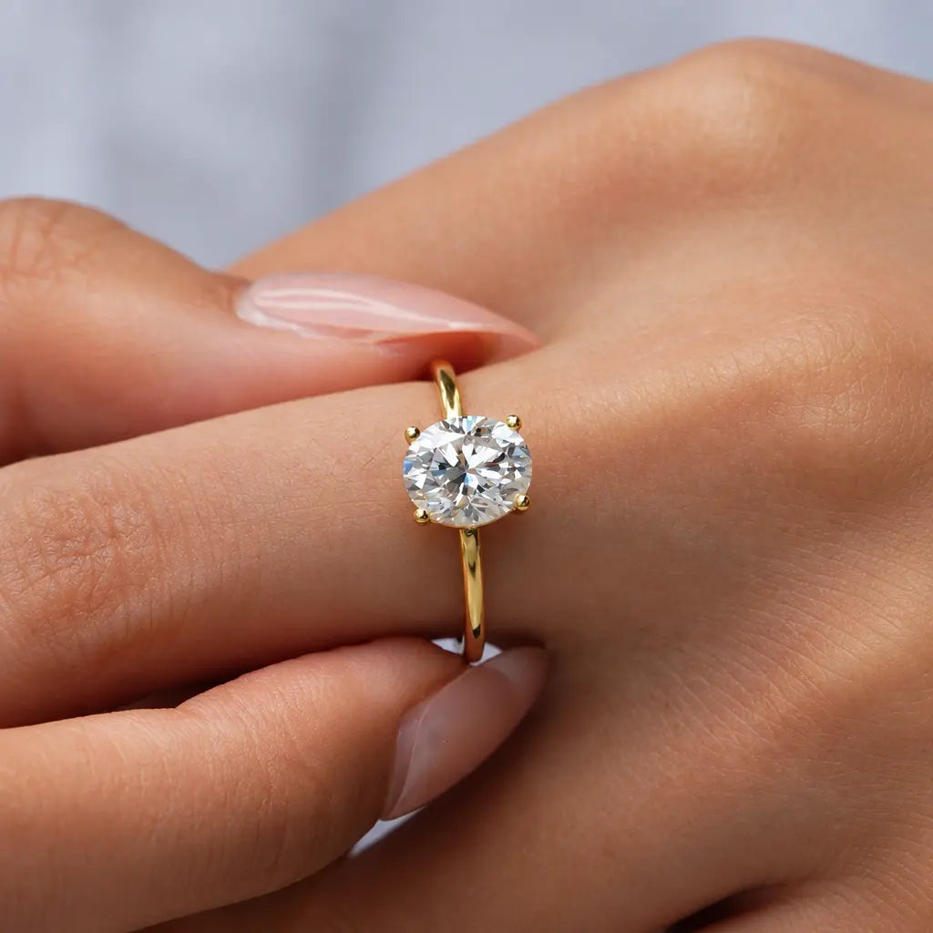 Gold-colored adjustable ring worn on a hand, showing its clear faceted centerpiece | ANNIRO Jewelry