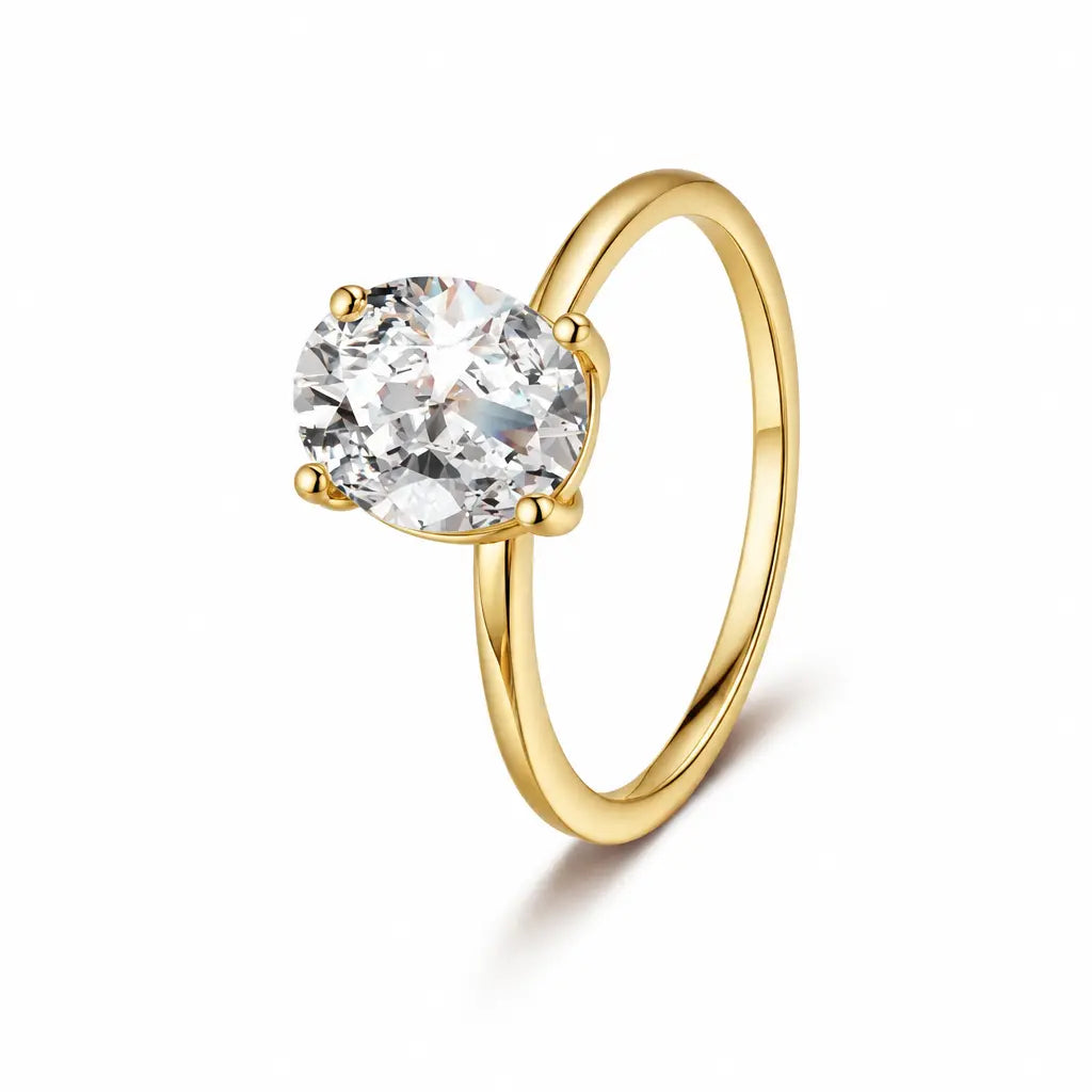 Gold-colored adjustable alloy ring with a clear faceted centerpiece on white | ANNIRO Jewelry