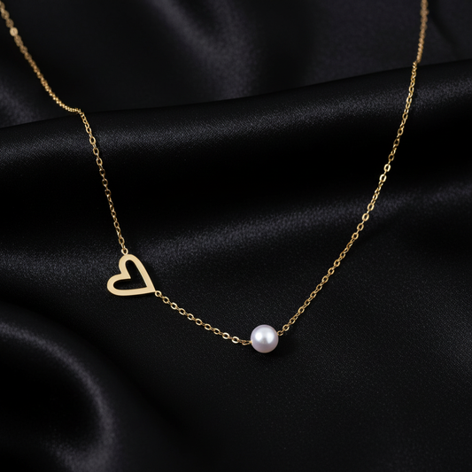 Pearl Heart Embrace Necklace on black silk background